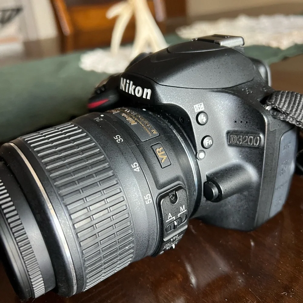 Nikon DSLR Camera in Black with Yellow-Accent Strap